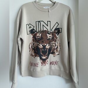 Anine Bing tiger sweatshirt on stone